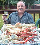 man eating crab legs